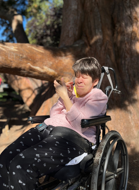 person in wheelchair enjoying sun